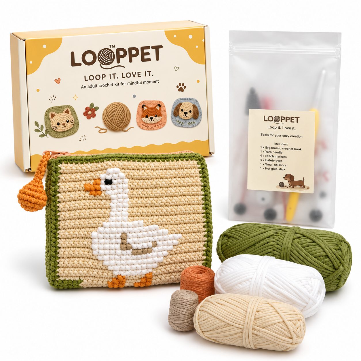 LOOPPET crochet coin purse kit with a white goose design, green trim, yarn, and tools